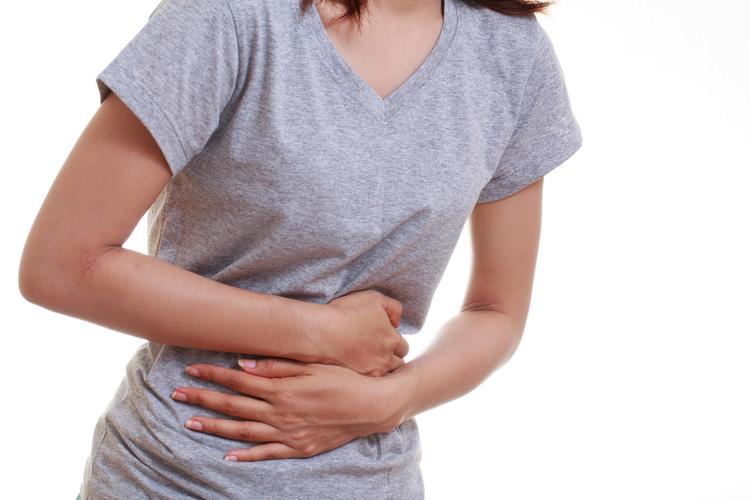 女人腹部地区和胃显示痛苦女生痛经肚子痛