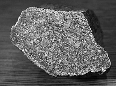nwa 6509,一块发现于西南非洲沙漠的ll球粒陨石,从截面可以清晰看到"