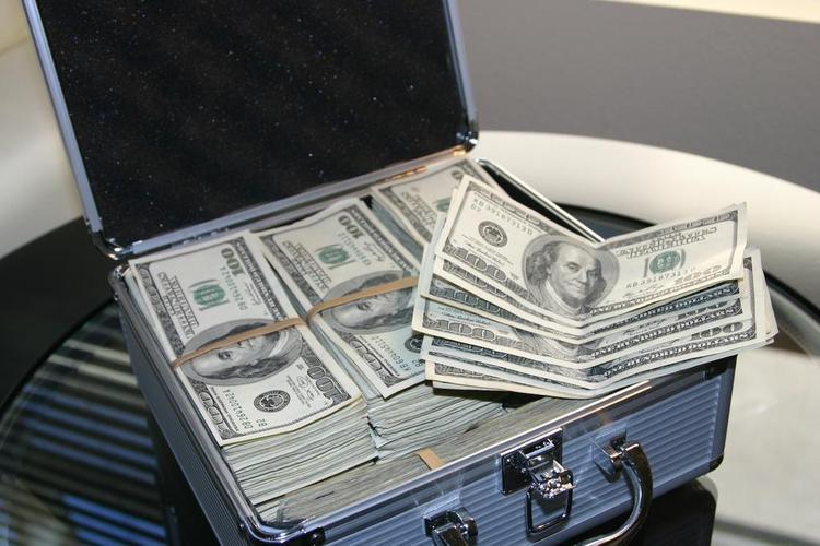 彩色金融简明保险箱中整齐放置的纸币钱币贸易交易背景图片