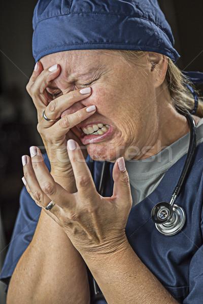 商业照片: hysterical agonizing crying female doctor or nurse.
