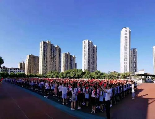 同升一面旗同唱一首歌禾山中学举行献礼七十周年主题体验活动之升旗