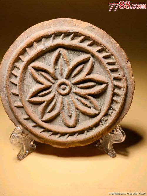 汉代制作瓦当使用的红陶花卉纹印模