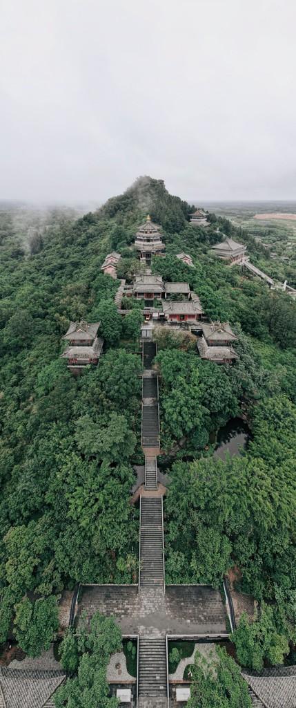 文笔峰位于海南省定安县的中部它平地拔起山色秀美为定安八大名景之一