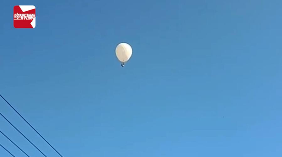 视频-吉林2名村民坐氢气球打松籽飞上天,落地后被警方带走