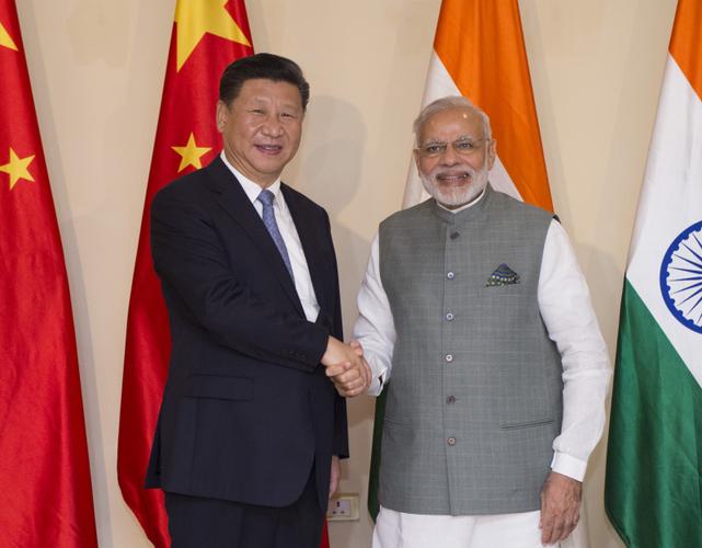 10月15日,国家主席习近平在印度果阿会见印度总理莫迪.