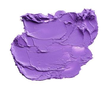 白色背景上分离的紫色口红纹理. 紫色唇膏照片