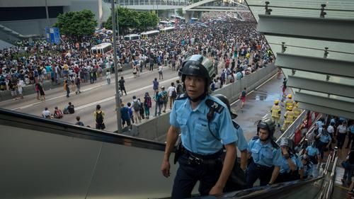 hong kong police use tear gas on large pro-democracy protest