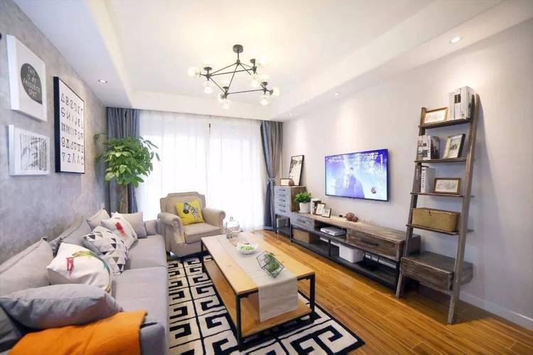 小户型客厅的电视背景墙简洁明快,以纯净的白色为主调,显得宽敞明亮.