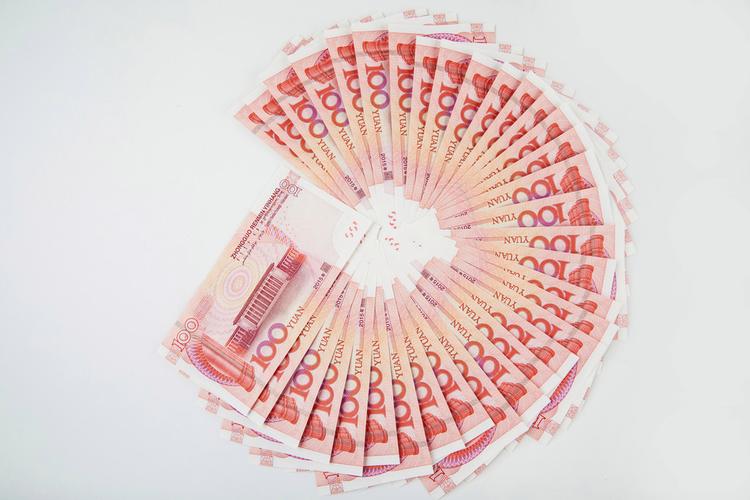 100元人民币图片桌面摆放钱币背景金融图片100元人民币图片百元人民币